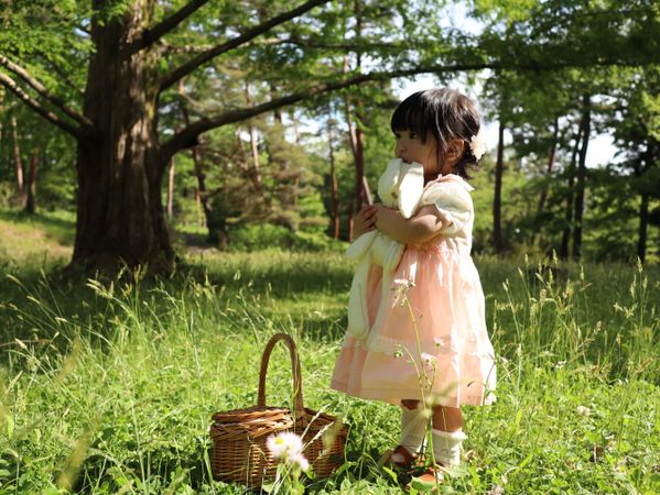 Young girl standing on grass