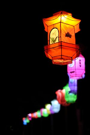 Colorful Japanese lanterns against dark background