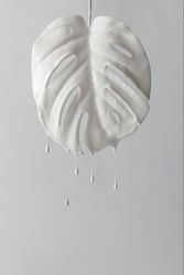 Painted monstera tropical leaf with dripping paint