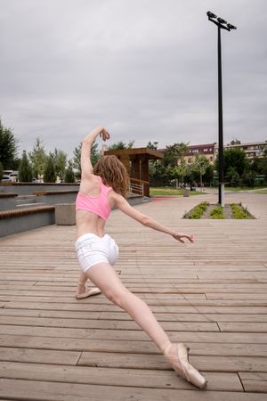 Unrecognizable ballet dancer in city street