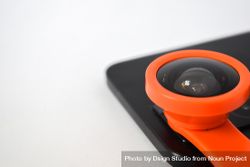 Close up of snap on lens add on on smartphone camera with copy space bE9R2M