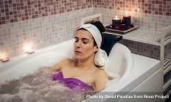 Female resting in therapeutic bath in spa 5RVPEr