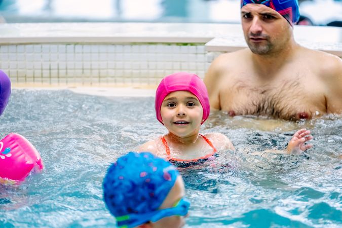 Family relaxing in bubbling pool