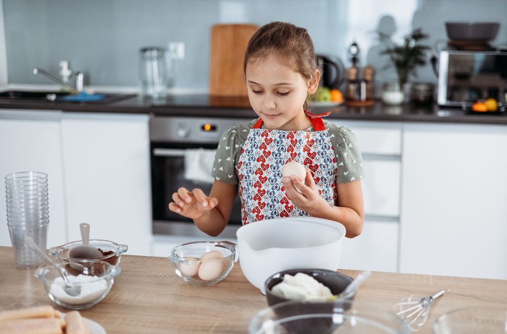 Girl making tiramisu dessert