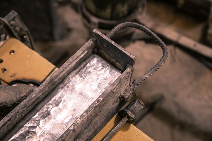 Heated metal in form on table
