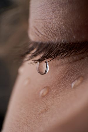 Unrecognizable depressed kid with tears