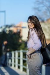 Woman in casual wear looking around on a sunny day