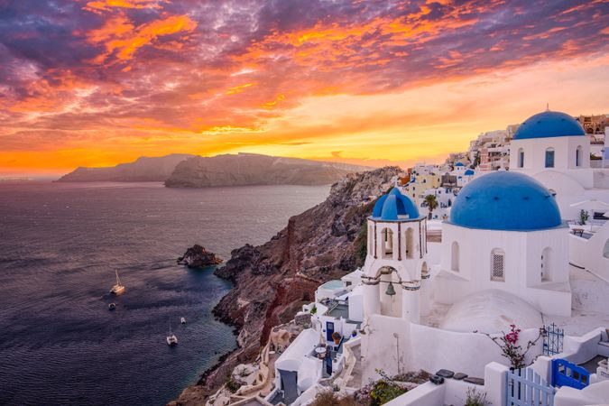 Famous blue domes of Santorini at sunset