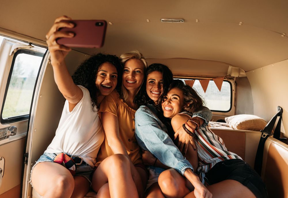 Smiling women taking selfie on vacation