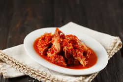 Spicy salted squid dish on wooden table