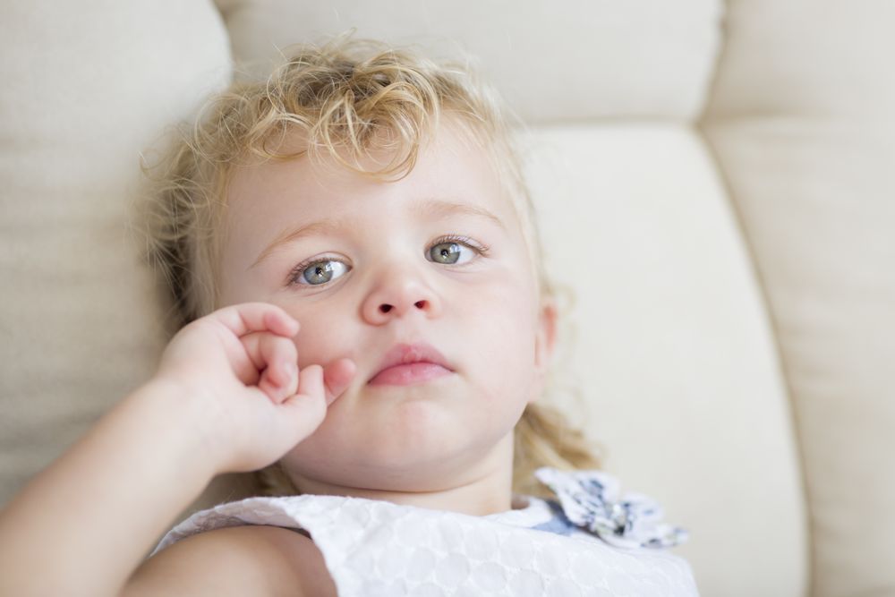 Cute Blonde Haired and Blue Eyed Little Girl in Chair