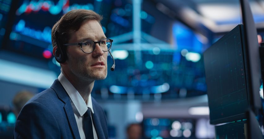White Male Stock Exchange Agent Having a Conversation on a Phone Call, Motivating a Client to Invest in a New Successful Startup That Just Went Public Through an IPO.