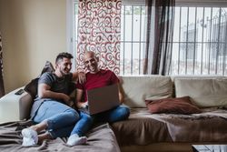 Gay couple with computer