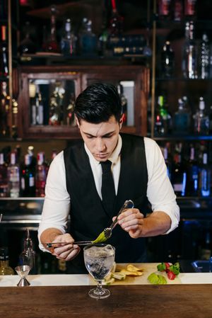 Barman working making drinks