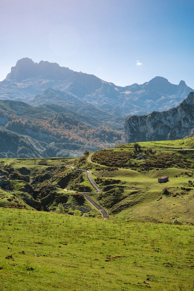 Landscape with path between mountains