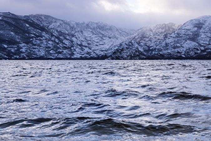 Shore with mountains near water