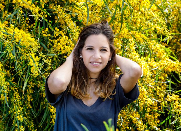 Young female near blooming bushes