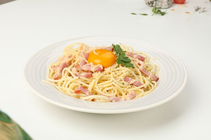 Plate with tasty pasta isolated on plain background