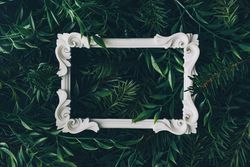 Picture frame immersed in densely packed leaves