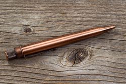 Vintage metal pen on old wood