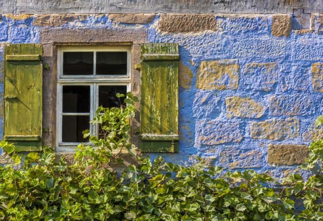 Traditional German house window and stone wall
