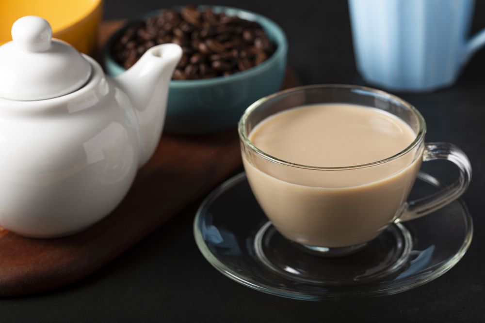 Cup of coffee with creamy milk.