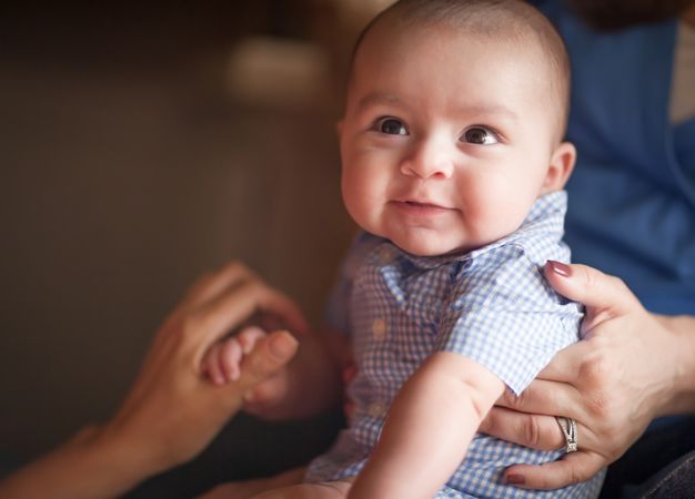 Cute Infant Having Fun with His Parents.