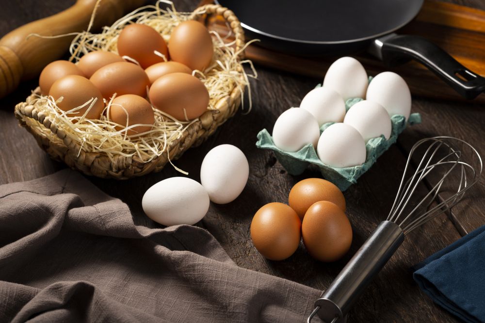 Chicken eggs go up on the table.