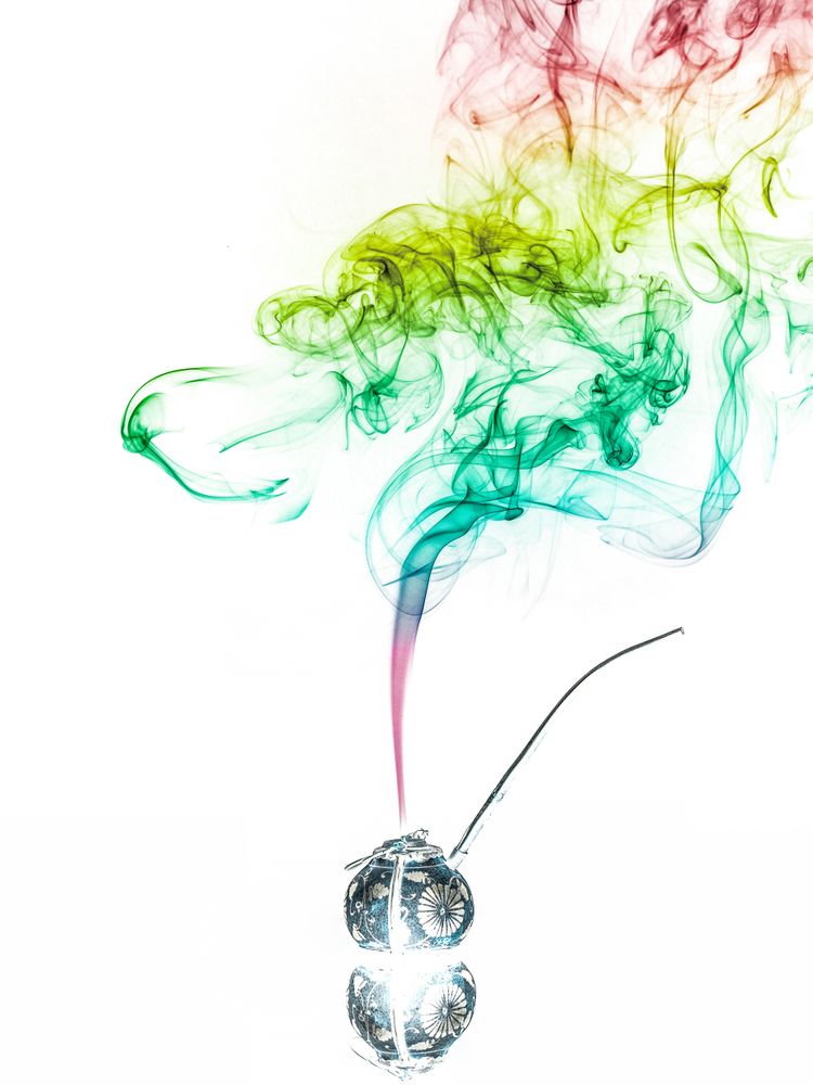 Jar with herbs emitting smoke