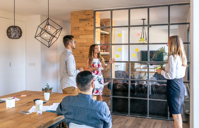 Business people talking in a work meeting sticking notes