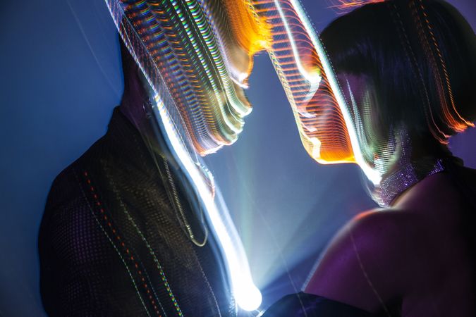 Traces of light on faces of couple
