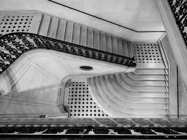 Gorgeous staircase in an old mansion in Paris. The luxury of a bygone era.
