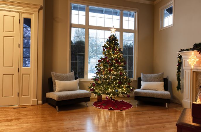 Home living room be decorated for a merry Christmas and happy New Year concept with snow visible outside