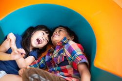 Two children laughing together