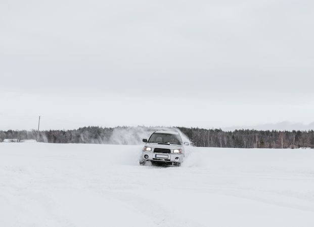 Car driving on snow field