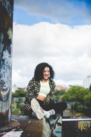 Laughing modern woman on grungy terrace