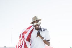 Cheerful black man with American flag