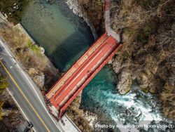 Top view of red metal bridge over the river in Nikko, Tochigi, Japan 0gRMXb