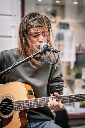 Male musician performing in the street