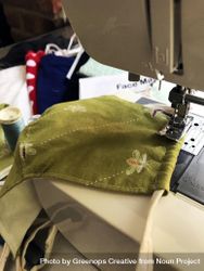 Fabric face mask being stitched on a sewing machine 5pogv0