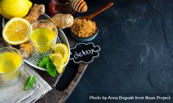Yellow detox drinks with ginger, lemon and honey with copy space 0gEAe4