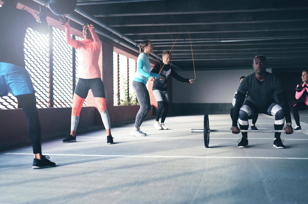 Group of diverse men and women doing circuit training