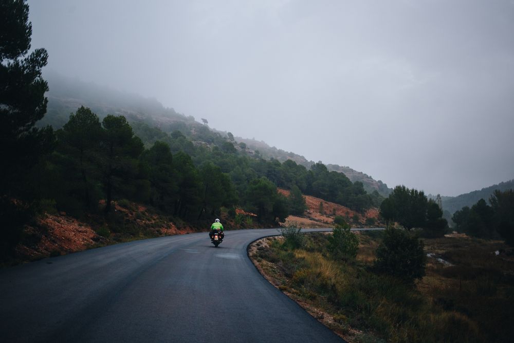 Motorcycle on mountainous road on an overcast day