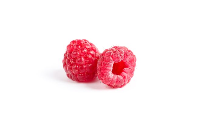 Fresh sweet raspberries isolated on blank background