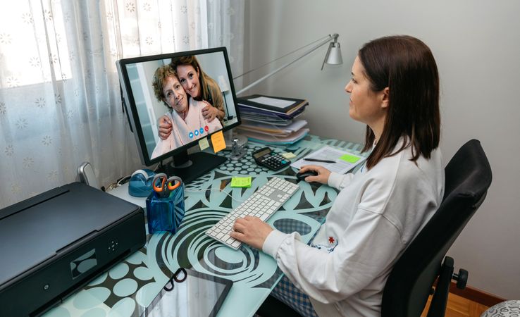 Woman talking on video call with her mother