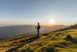 Older man posing on the mountain