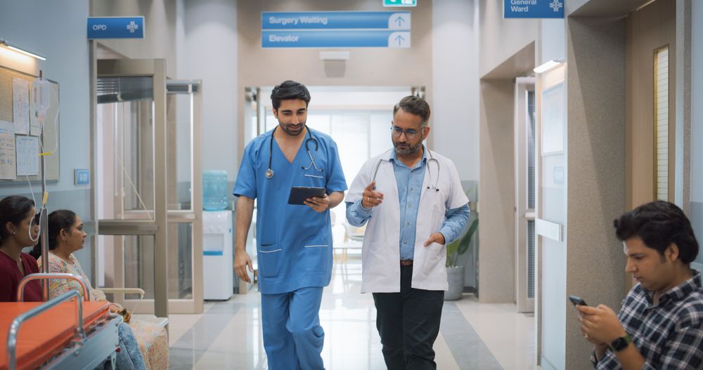Two Medical Specialists Discussing the Treatment of a Patient