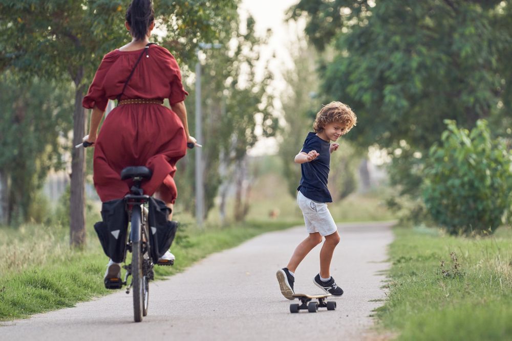 Active pastime of mother with child outside