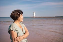 Woman gazing at sea horizon