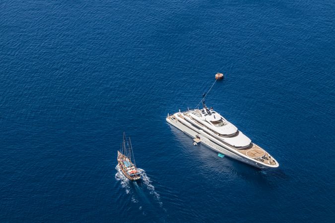 High view of yacht and small boat in the sea